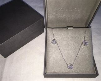 DIAMOND FLEURETTE 18 KT WHITE GOLD AND 1.64 CARAT DIAMOND NECKLACE: LOTS OF FIRE AND SPARKLE.
Signed appraisal report included. Gift Box Included.
One stamped and tested 18KT white gold lady's hand assembled three diamond cluster necklace with a shared prong set.
18KT white gold lobster clasp and bright polish finish.
Identified with markings of "18kt/750".
Condition: Excellent. Light scratches on metal.
Total Weight of Diamonds: 1.64 ct.
Total Weight of Three Diamond Cluster Necklace: 6.00 gm.
Three shared prong set round brilliant cut diamonds exact total weight of 3 stones = 0.52 ct.
Clarity: VS. Color: F. Cut: Excellent
Twenty-four shared prong set round brilliant cut diamonds exact total weight 24 stones = 1.12ct.
Clarity VS. Color: F-G. Cut: Excellent.
Price: $2,900