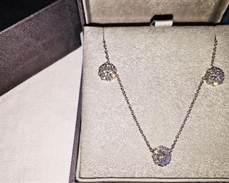 DIAMOND FLEURETTE 18 KT WHITE GOLD AND 1.64 CARAT DIAMOND NECKLACE: LOTS OF FIRE AND SPARKLE.
Signed appraisal report included. Gift Box Included.
One stamped and tested 18KT white gold lady's hand assembled three diamond cluster necklace with a shared prong set.
18KT white gold lobster clasp and bright polish finish.
Identified with markings of "18kt/750".
Condition: Excellent. Light scratches on metal.
Total Weight of Diamonds: 1.64 ct.
Total Weight of Three Diamond Cluster Necklace: 6.00 gm.
Three shared prong set round brilliant cut diamonds exact total weight of 3 stones = 0.52 ct.
Clarity: VS. Color: F. Cut: Excellent
Twenty-four shared prong set round brilliant cut diamonds exact total weight 24 stones = 1.12ct.
Clarity VS. Color: F-G. Cut: Excellent.
Price: $2,900
