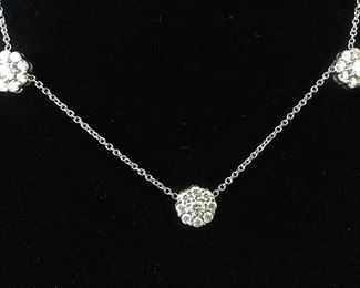 DIAMOND FLEURETTE 18 KT WHITE GOLD AND 1.64 CARAT DIAMOND NECKLACE: LOTS OF FIRE AND SPARKLE.
Signed appraisal report included. Gift Box Included.
One stamped and tested 18KT white gold lady's hand assembled three diamond cluster necklace with a shared prong set.
18KT white gold lobster clasp and bright polish finish.
Identified with markings of "18kt/750".
Condition: Excellent. Light scratches on metal.
Total Weight of Diamonds: 1.64 ct.
Total Weight of Three Diamond Cluster Necklace: 6.00 gm.
Three shared prong set round brilliant cut diamonds exact total weight of 3 stones = 0.52 ct.
Clarity: VS. Color: F. Cut: Excellent
Twenty-four shared prong set round brilliant cut diamonds exact total weight 24 stones = 1.12ct.
Clarity VS. Color: F-G. Cut: Excellent.
Price: $2,900