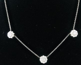 DIAMOND FLEURETTE 18 KT WHITE GOLD AND 1.64 CARAT DIAMOND NECKLACE: LOTS OF FIRE AND SPARKLE.
Signed appraisal report included. Gift Box Included.
One stamped and tested 18KT white gold lady's hand assembled three diamond cluster necklace with a shared prong set.
18KT white gold lobster clasp and bright polish finish.
Identified with markings of "18kt/750".
Condition: Excellent. Light scratches on metal.
Total Weight of Diamonds: 1.64 ct.
Total Weight of Three Diamond Cluster Necklace: 6.00 gm.
Three shared prong set round brilliant cut diamonds exact total weight of 3 stones = 0.52 ct.
Clarity: VS. Color: F. Cut: Excellent
Twenty-four shared prong set round brilliant cut diamonds exact total weight 24 stones = 1.12ct.
Clarity VS. Color: F-G. Cut: Excellent.
Price: $2,900