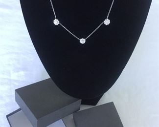 DIAMOND FLEURETTE 18 KT WHITE GOLD AND 1.64 CARAT DIAMOND NECKLACE: LOTS OF FIRE AND SPARKLE.
Signed appraisal report included. Gift Box Included.
One stamped and tested 18KT white gold lady's hand assembled three diamond cluster necklace with a shared prong set.
18KT white gold lobster clasp and bright polish finish.
Identified with markings of "18kt/750".
Condition: Excellent. Light scratches on metal.
Total Weight of Diamonds: 1.64 ct.
Total Weight of Three Diamond Cluster Necklace: 6.00 gm.
Three shared prong set round brilliant cut diamonds exact total weight of 3 stones = 0.52 ct.
Clarity: VS. Color: F. Cut: Excellent
Twenty-four shared prong set round brilliant cut diamonds exact total weight 24 stones = 1.12ct.
Clarity VS. Color: F-G. Cut: Excellent.
Price: $2,900