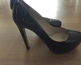 MIU MIU BLACK PATENT LEATHER PLATFORM PUMPS: Size 37. Heel Height: 5 inches. Platform Height: 1 inch. Price: $100.