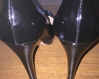 MIU MIU BLACK PATENT LEATHER PLATFORM PUMPS: Size 37. Heel Height: 5 inches. Platform Height: 1 inch. Price: $100.