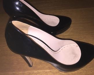 MIU MIU BLACK PATENT LEATHER PLATFORM PUMPS: Size 37. Heel Height: 5 inches. Platform Height: 1 inch. Price: $100.