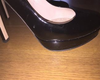 MIU MIU BLACK PATENT LEATHER PLATFORM PUMPS: Size 37. Heel Height: 5 inches. Platform Height: 1 inch. Price: $100.