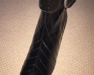 YVES ST. LAURENT BLACK EEL SKIN ANKLE BOOTS: Size 7.5. Condition: New. Excellent. Price: $200.