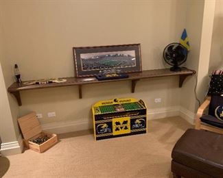 Michigan Wolverines pillows, throws, toy box, chess pieces.