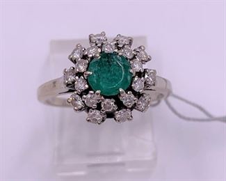 Vintage diamond and emerald ring in 14K white gold.