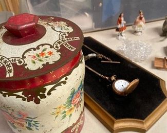 Vintage tea canister. Antique pocket watch