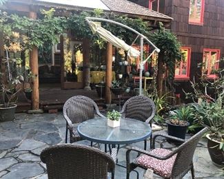 Lawn furniture and umbrella plus large potted planters 
