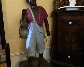 Early cast iron Underground Railroad lawn jockey land marker.