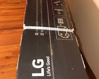 CLOSE OF VIEW OF NEW FACTORY SEALED BOX OF LG OLED TV WITH RARE 4 K - 65 INCHES