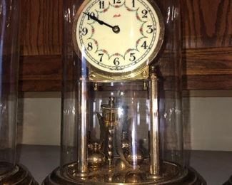 CLOSE UP VIEW OF RARE COLLECTION OF RARE ANTIQUE SIGNED GERMAN GLASS DOME BRASS CLOCKS