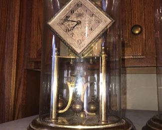 CLOSE UP VIEW OF RARE COLLECTION OF RARE ANTIQUE SIGNED GERMAN GLASS DOME BRASS CLOCKS