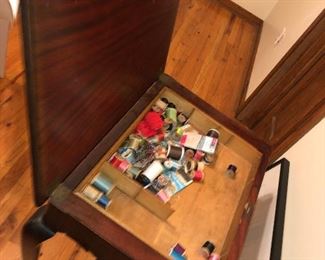 OPEN VIEW OF 19TH CENTURY AMERICAN ROCOCO FLIP TOP FLAME MAHOGANY SEWING CABINET.