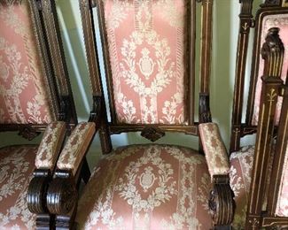 CLOSE UP VIEW OF ARMCHAIR AN EXTREMELY RARE JOHN HERTER VICTORIAN PARLOR SUITE CIRCA 1870 OF CARVED WALNUT & GOLD PAINTED ADORNMENT DECORATIONS -A 7 PIECE SET INCLUDING SOFA, 2 ARM CHAIRS, 4 CHAIRS.  