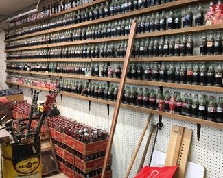 Tons of Coca Cola bottles and related collectibles