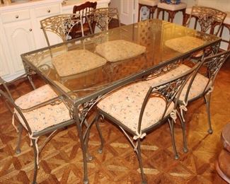 Glass and metal table with six chairs