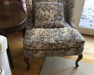 One of two matching accent chairs.