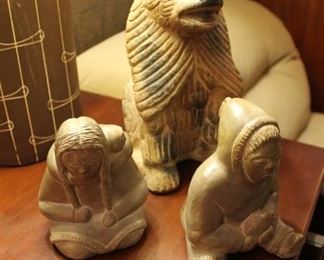 Carved soapstone figurines, Canada.  Mexican terracotta pottery is sold.