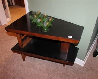 Vintage MCM triangle end table is sold.
