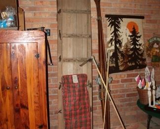 Vintage toboggan and vintage wooden skiis and poles