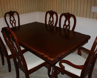 Matching Dining Table has 8 chairs