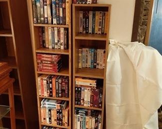 2 shelf units with VHS tapes