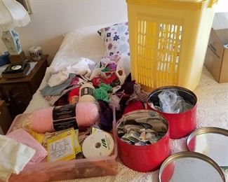 assorted quilting and sewing supplies and hamper