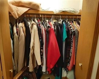 All women's clothes and Coats in closet