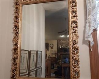Beveled edge mirror with ornate frame
