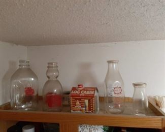 Milk bottles and syrup can