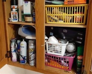 Contents of cabinet - light bulbs, flex seal and iron