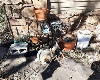 Plant stand, planters and bucket of sea sells