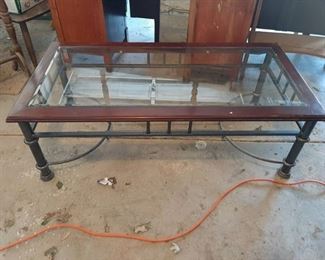 Coffee table with metal legs and beveled glass top