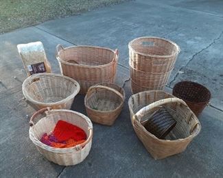 Assorted large baskets and straw bale