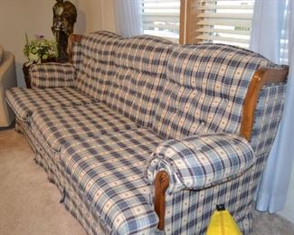 Country styled three cushion sofa in good condition.
