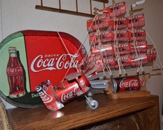 Unique Coke can sculptures and vintage looking tin tray.