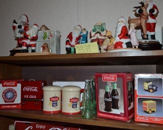 Several Coca Cola salt and pepper shakers, oven timer, toothpick holder. Musical and non-musical Santa figurines.
