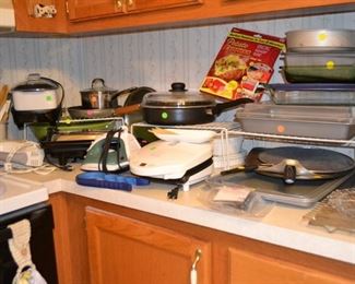 Lots of small kitchen appliances, pots, pans and cooking utensils - all priced to sell!