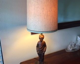 Wooden based carved antique lamp with base as image of boy