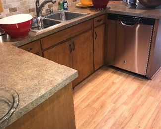 Kitchen countertops, cabinets, stainless sink, flooring