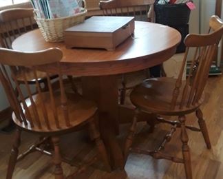 Oak Pedestal Table, it has been refinished. 4 maple chairs.