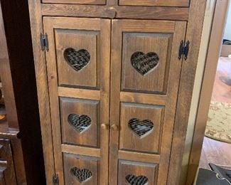 Pine cabinet with screamed heart cut outs