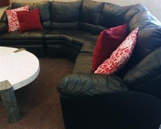 Black Leather Sectional and Asymmetrical coffee and sofa table in white/black