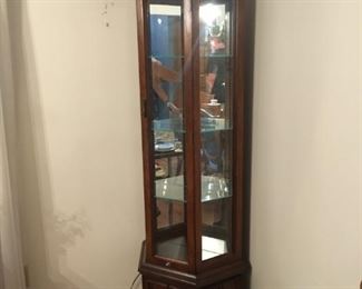 narrow lighted curio cabinet