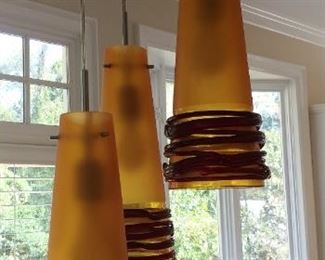 Signed Oggetti 3 pendulum light fixtures. Made in Murano, Italy.
Each pendulum $375
3 light canopy $140
