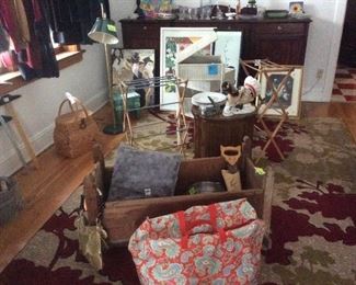 Antique baby cradle, area rugs. Baskets