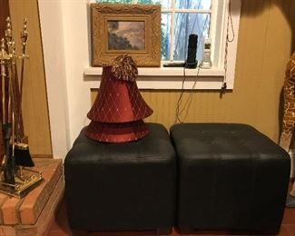 2 black leather matching foot stools