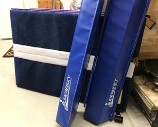 Kids practice tumbling mat and balance beams